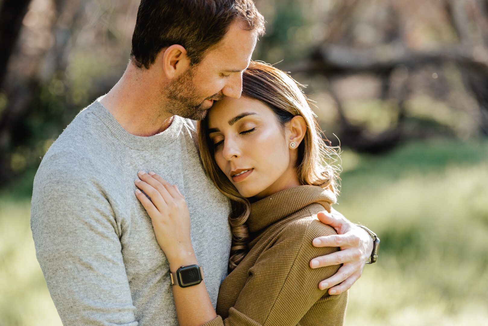 A girl rests her head on her partner chest