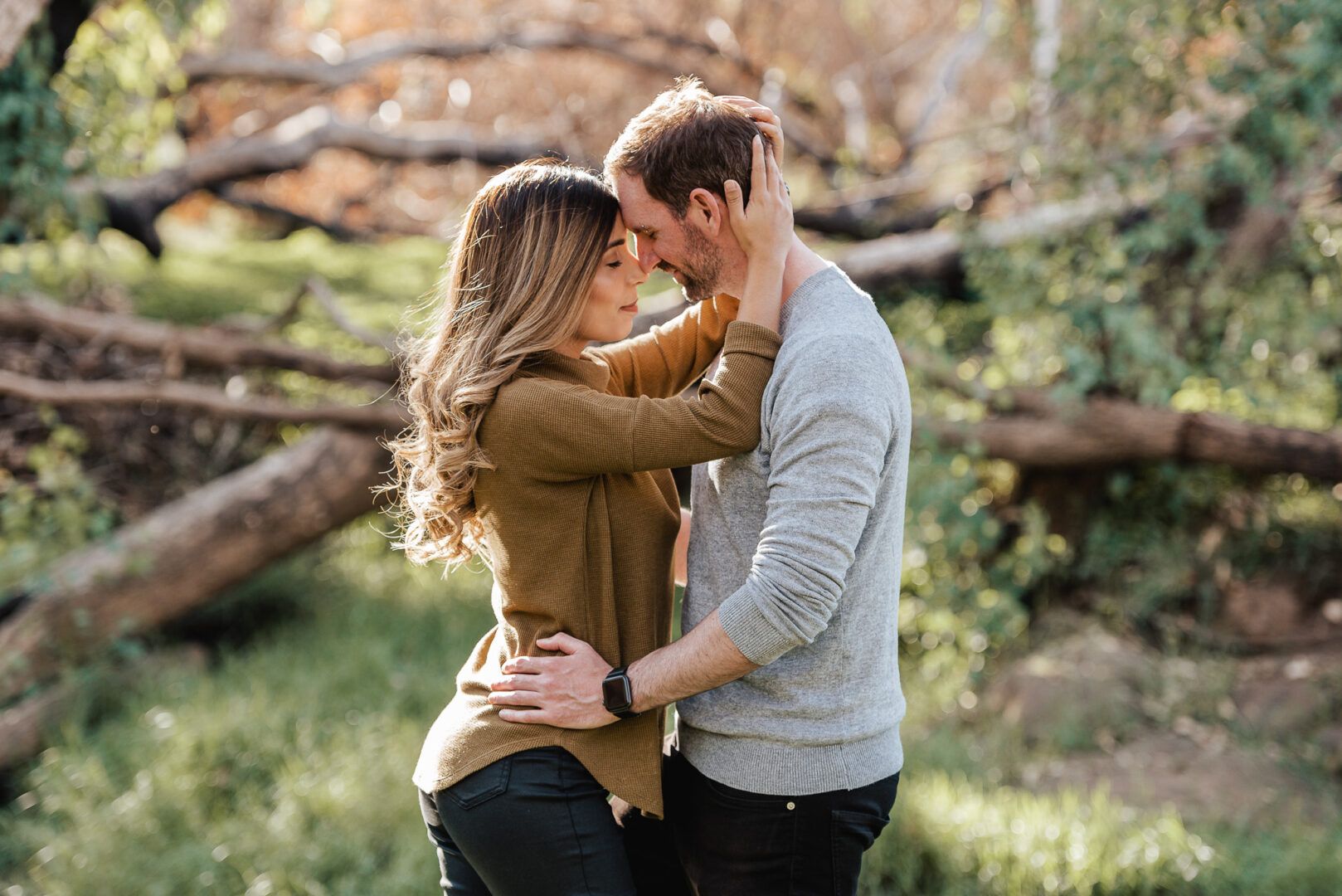 Boyfriend and girlfriend hold each other tight touching heads