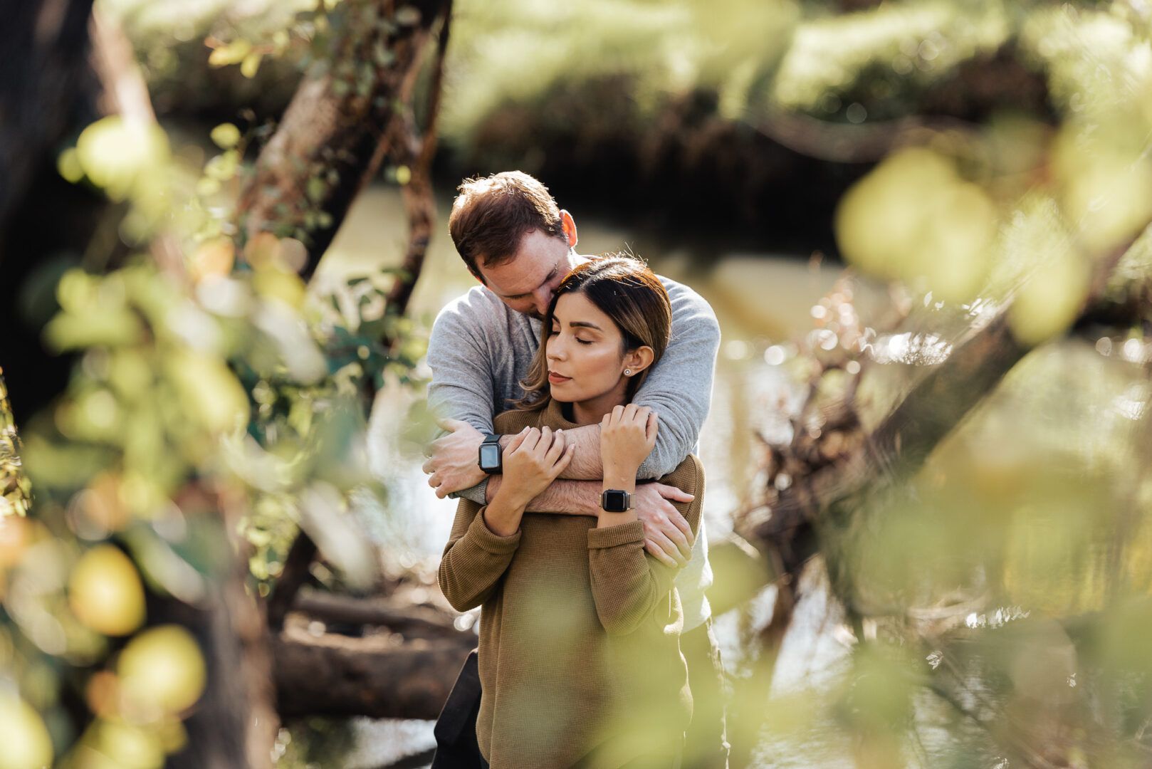 A man and a woman hold tight and enjoy a moment of peace together